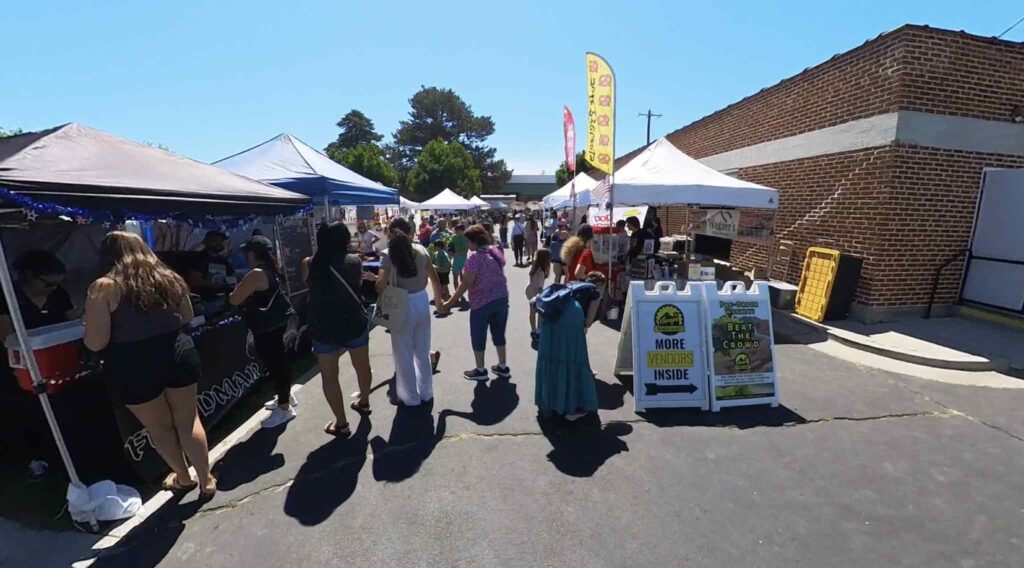 Crowds shopping at the Nampa Farmers Market in downtown Nampa Idaho with local vendors and fresh produce