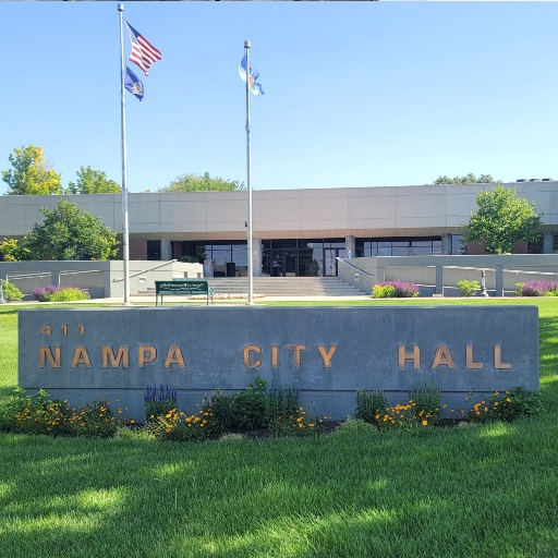 Nampa City Hall building in Nampa, Idaho, with city signage and flags