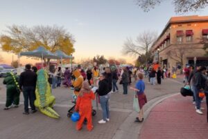Families and children in Halloween costumes gathered at a community event in downtown Nampa, Idaho.
