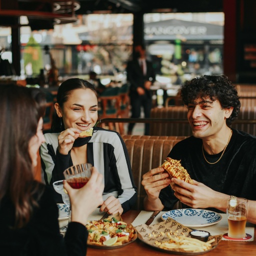 People enjoying a meal together at a restaurant, representing dining options in Nampa, Idaho
