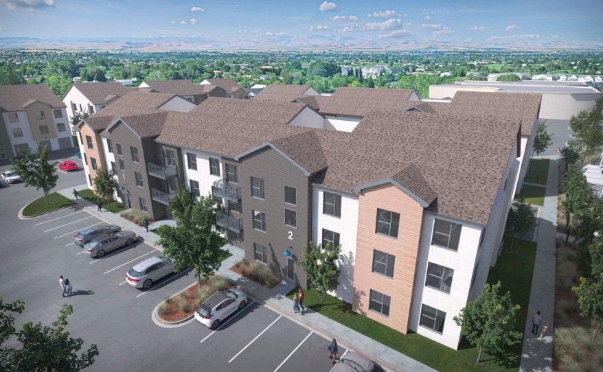 Nampa Sugar District apartments rendering showing three-story buildings and parking