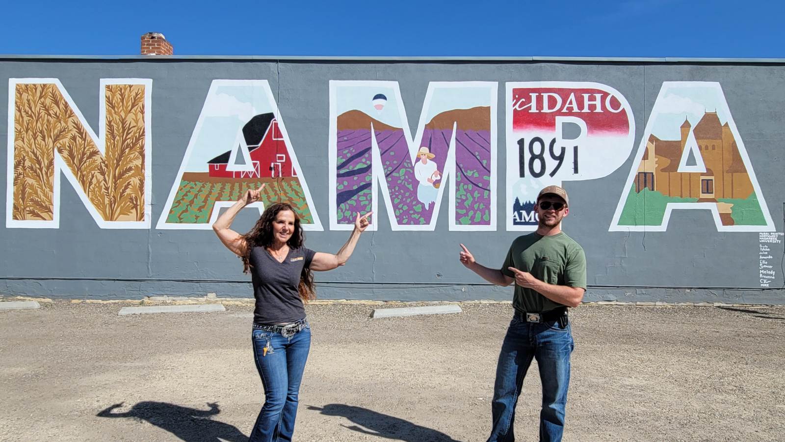 Nampa Idaho name mural painted on building wall showing local history and agriculture est 1891